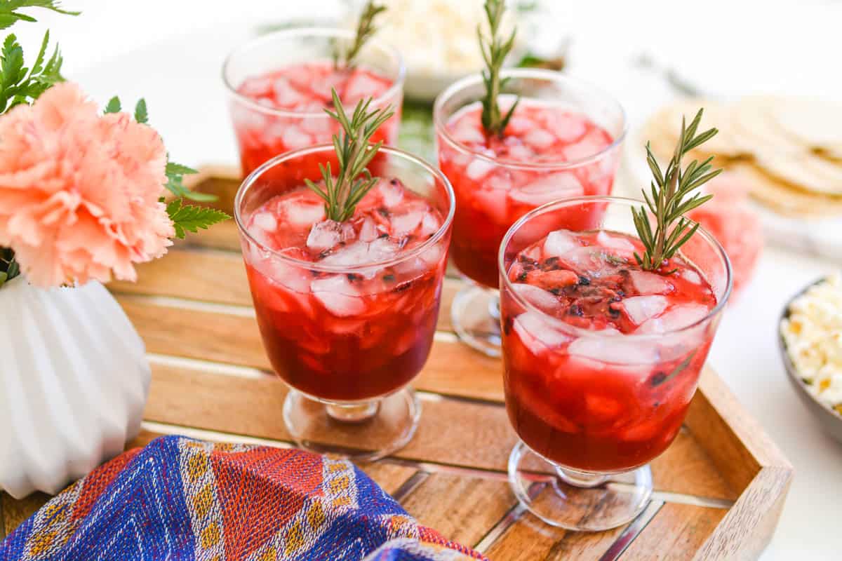 A tray of cocktails on a table.