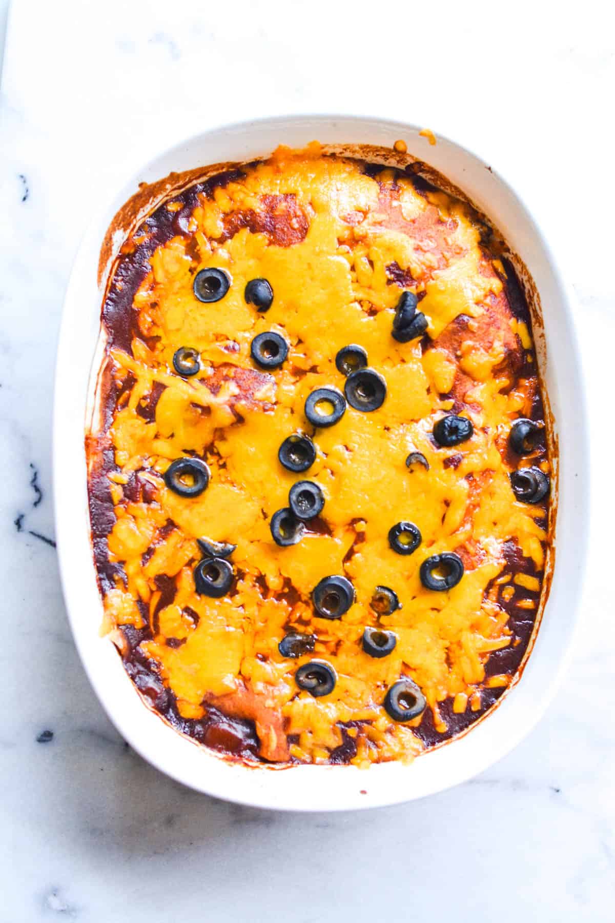 Close up of a chicken enchilada casserole with sloppy joe sauce