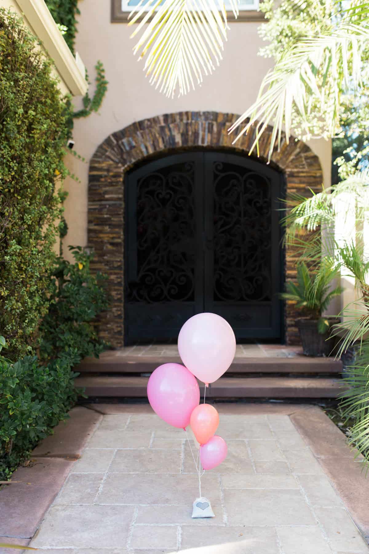 Valentine balloon bouquet on a porch.