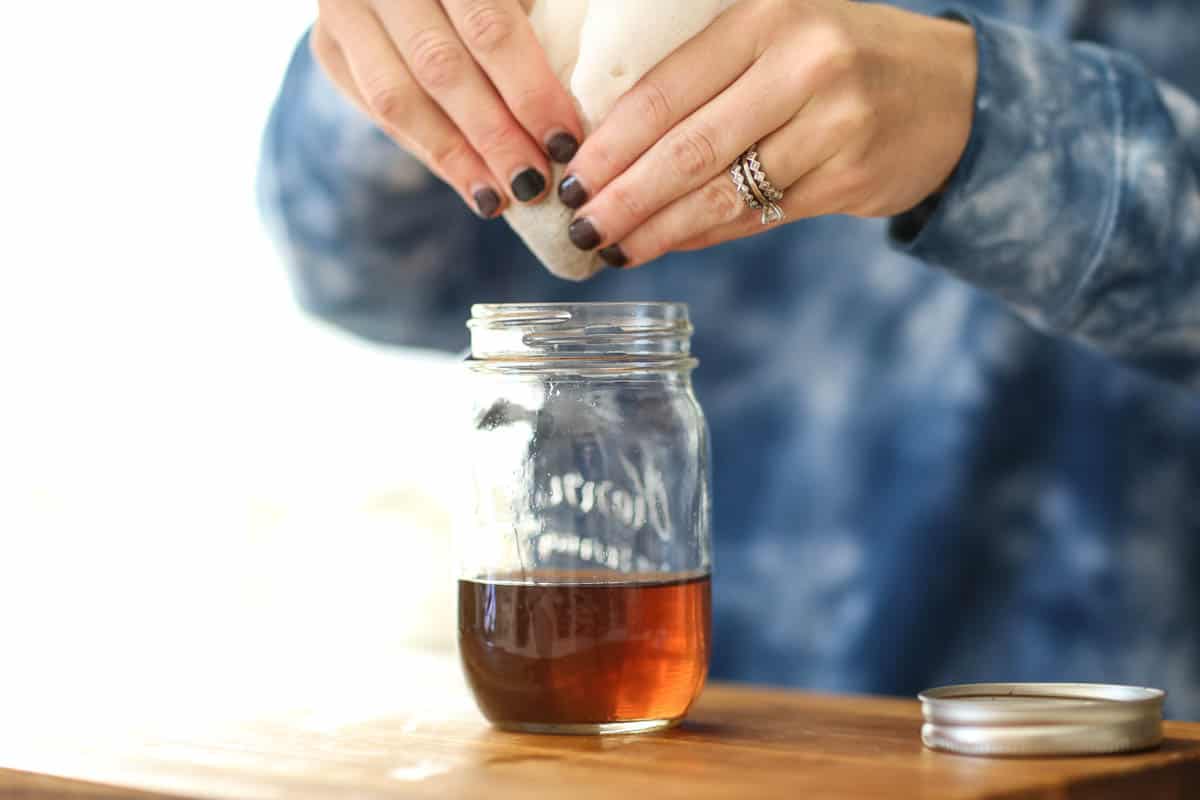 Close up of a jar with lavender infused water. 