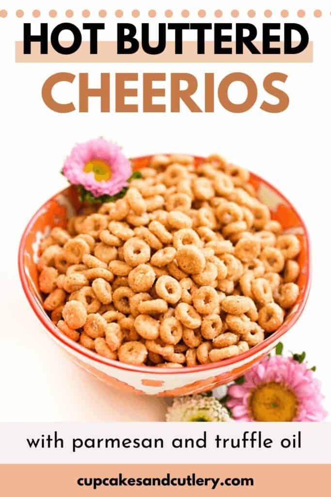 Text - Hot Buttered Cheerios with parmesan and truffle oil with a bowl of fried cheerios on a table next to flowers.