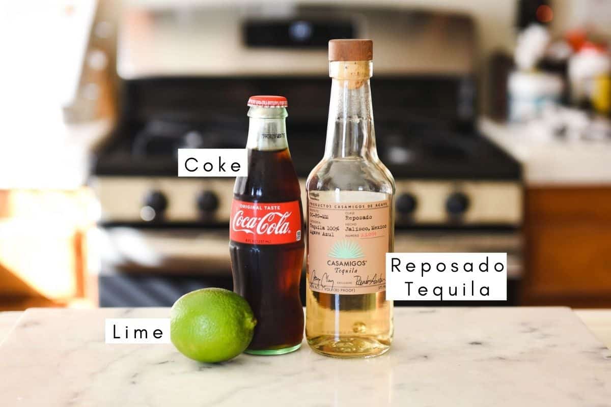 Labeled ingredients to make a tequila with Coke cocktail. 