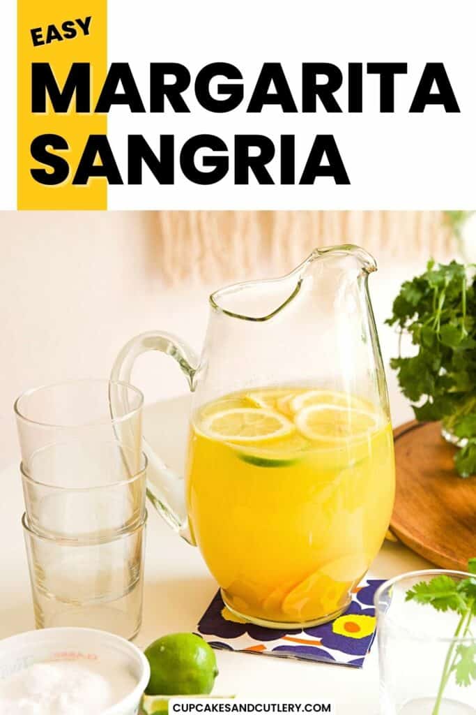 Text - Easy Margarita Sangria with a pitcher holding a bright yellow cocktail with sliced limes and lemons floating in it.