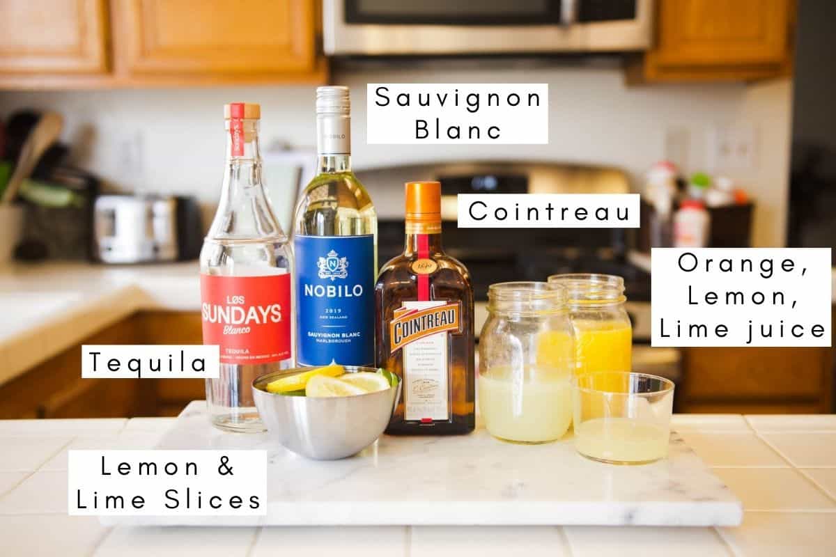 Labeled ingredients to make a margarita sangria recipe. 