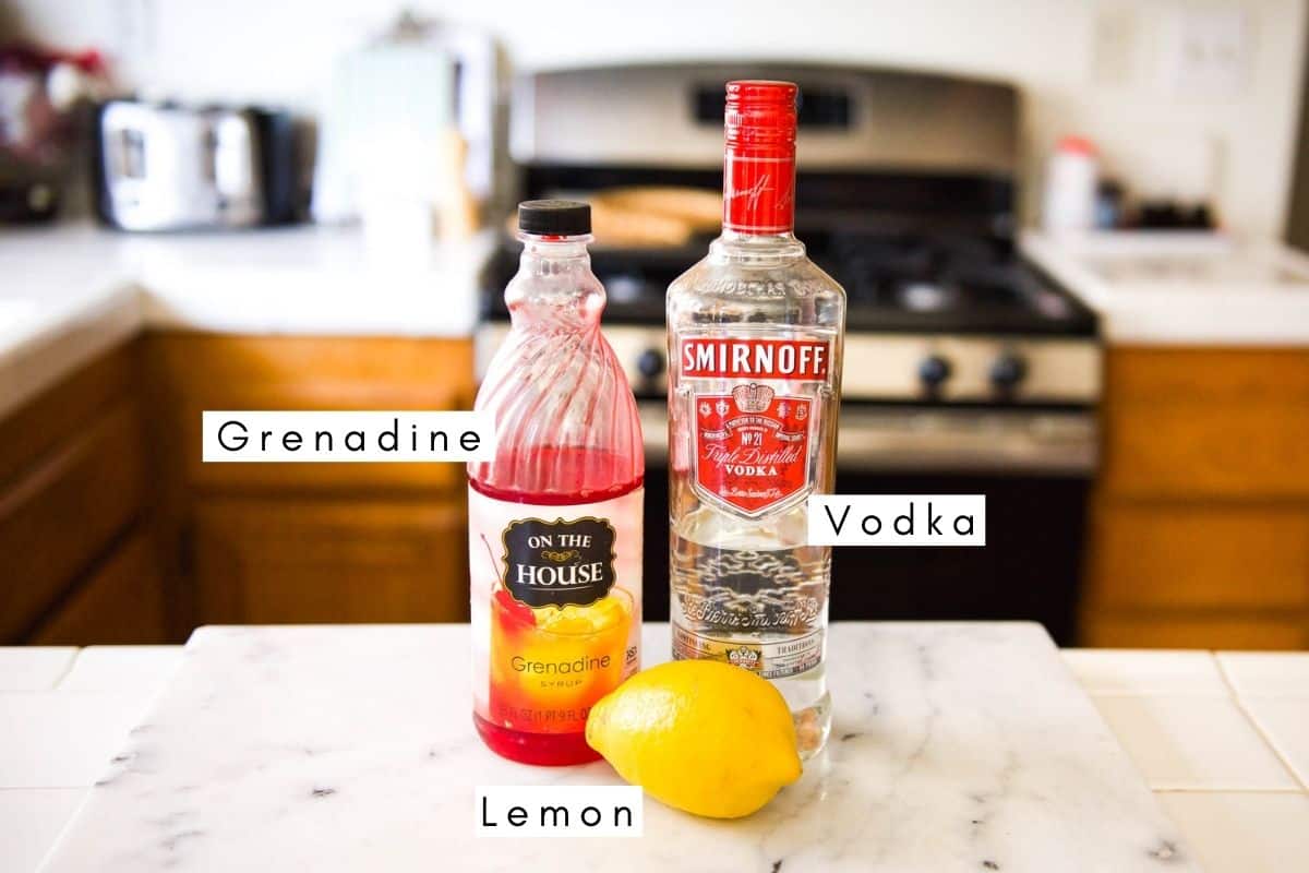 Labeled ingredients to make a cherry vodka sour recipe.