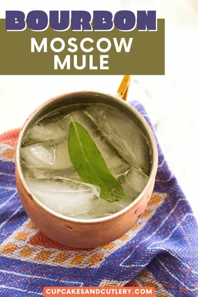 Overhead shot of a Moscow Mule made with bourbon in a copper mug with text over it.