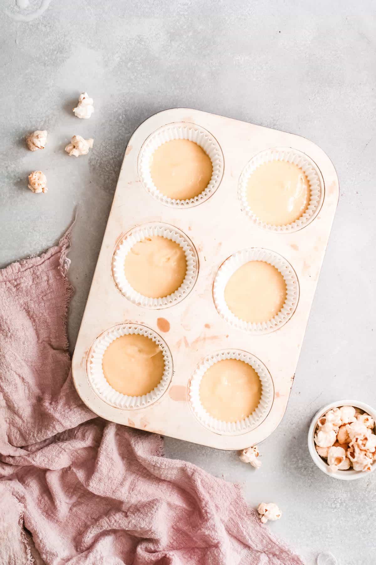 Batter poured into a cupcake tin.