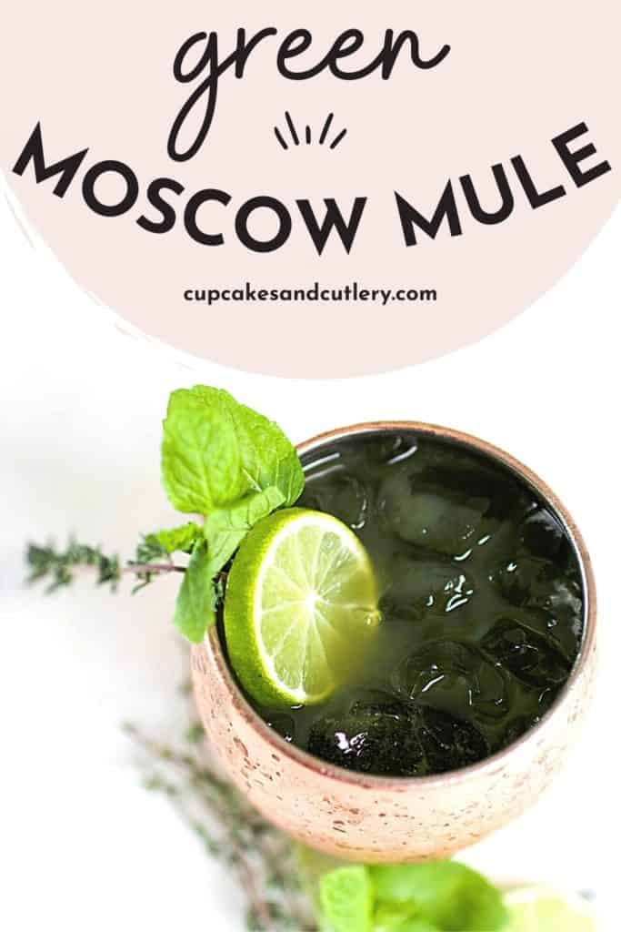 Text - Green Moscow Mule from Cupcakes and Cutlery with a green cocktail idea in a copper Mule mug with green herbs and lime garnish.