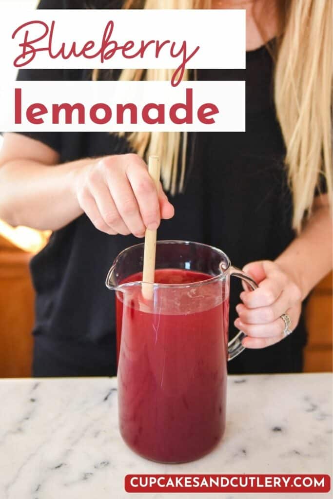 Woman stirring a pitcher of blueberry lemonade.