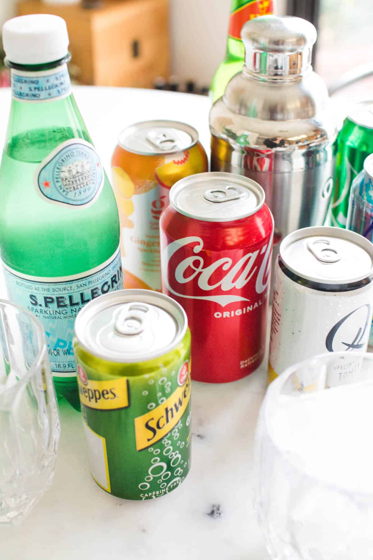 A variety of cans and bottles of things you can use as bar mixers for cocktails.