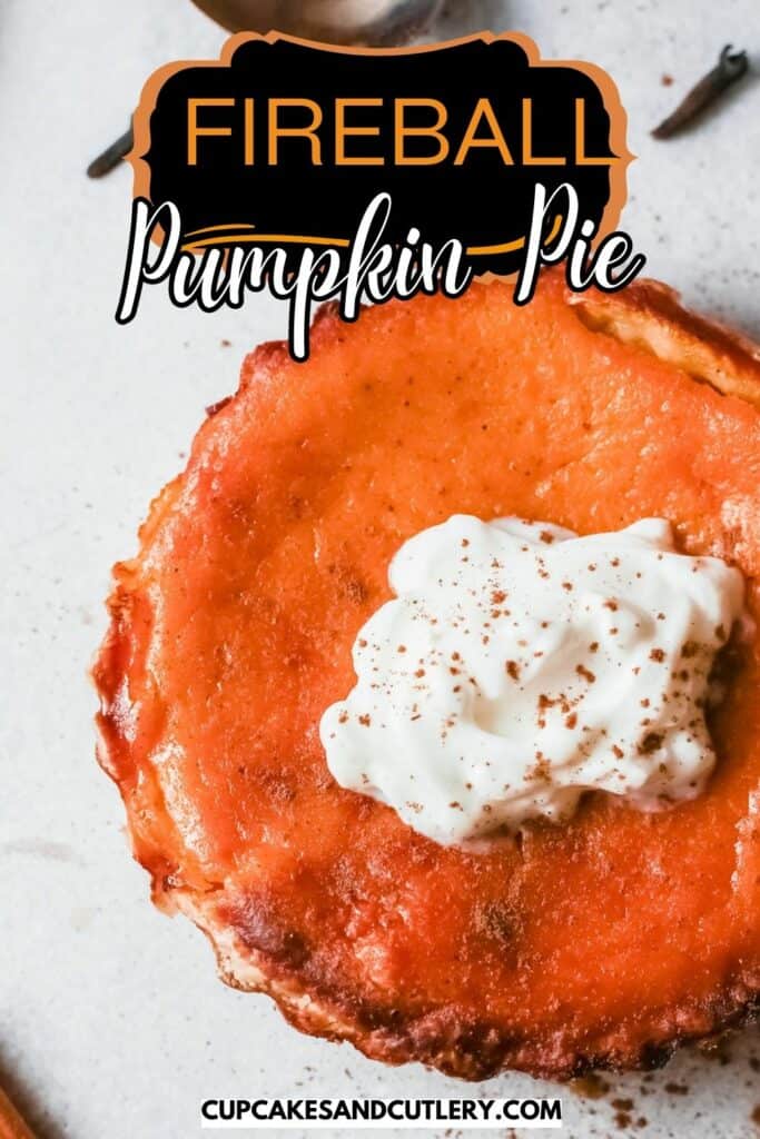 Text: Fireball Pumpkin Pie with a close up of a mini pumpkin pie topped with whipped cream that has been infused with Fireball whiskey.