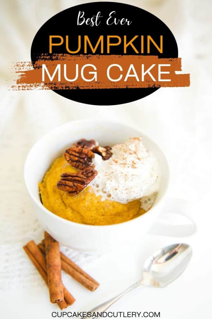 Text: Best Ever Pumpkin Mug Cake with a white mug filled with a pumpkin cake topped with whipped cream and pecans.