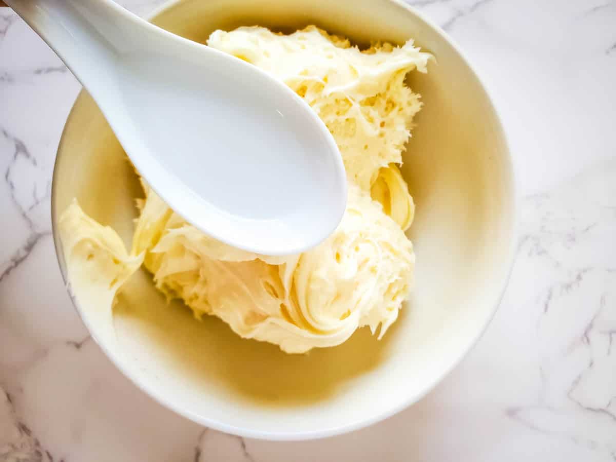 Coconut cupcake from cake mix batter being mixed.