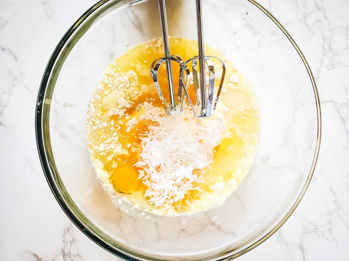 Ingredients of coconut cupcakes recipe in a bowl.