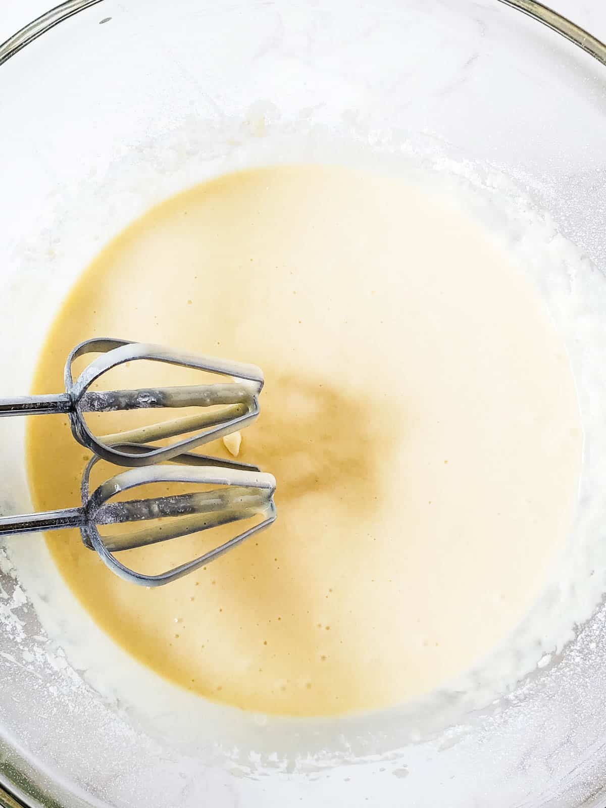 Cognac cupcake batter made using yellow cake mix.