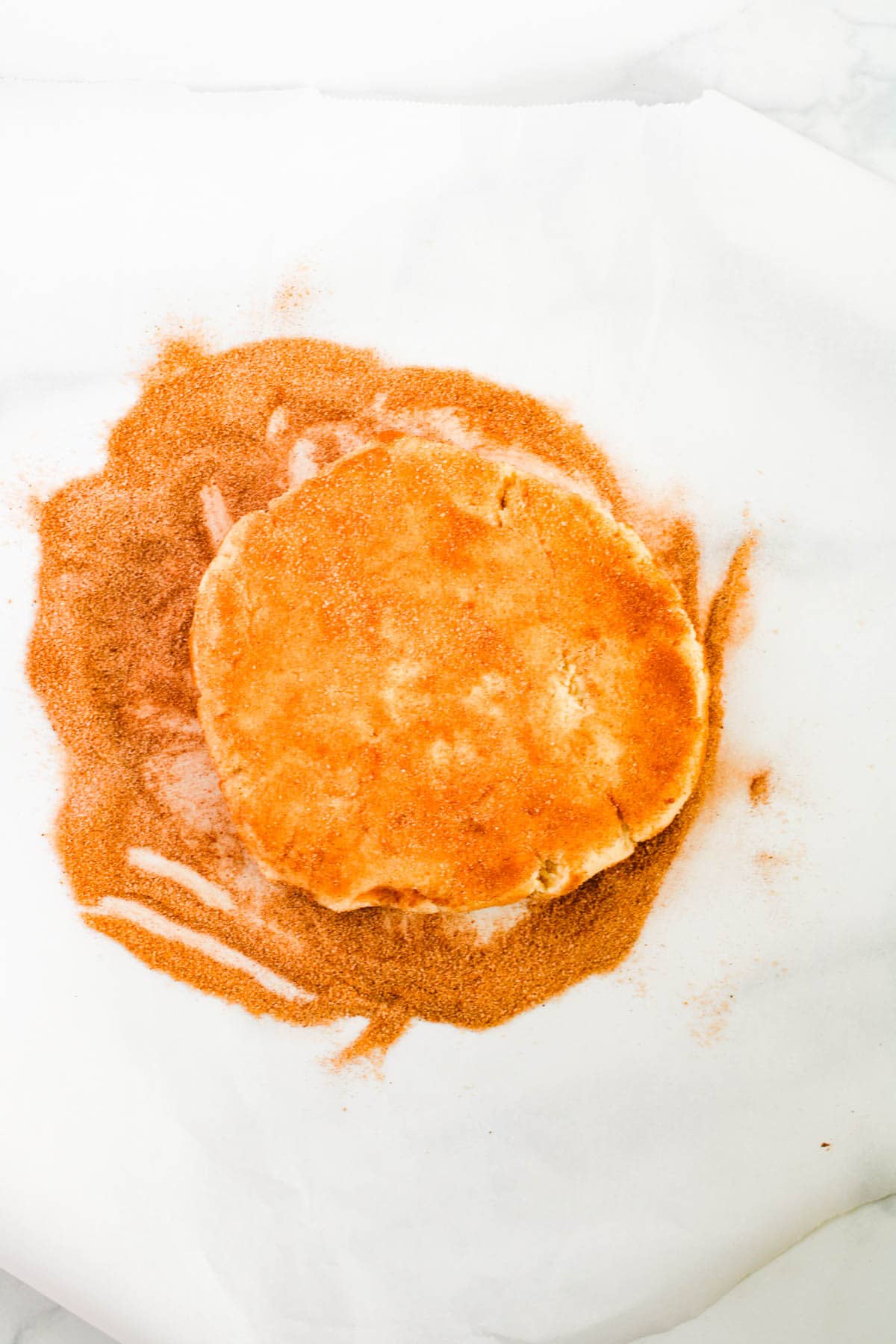 Rolling sugar cookie dough in cinnamon and sugar to make it a giant snickerdoodle.