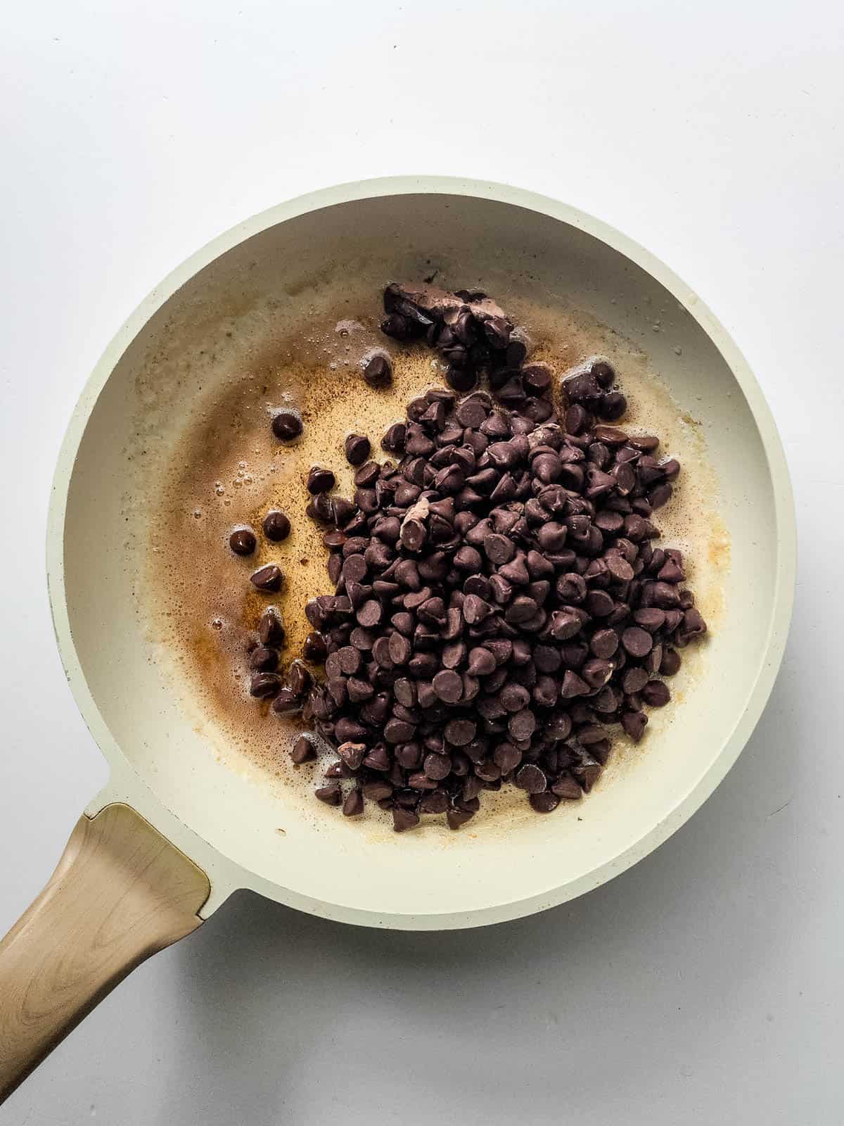 Butter and chocolate chips on a saucepan.