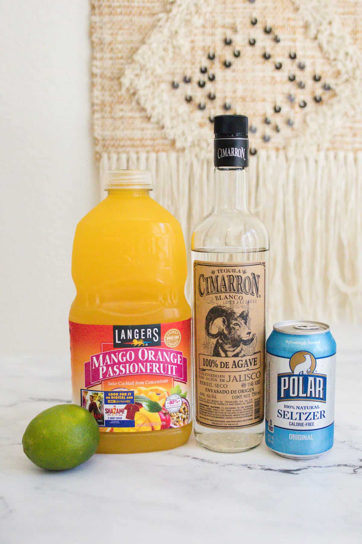 Tequila Spritz ingredients on a countertop.